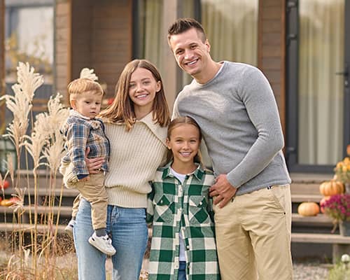A Happy Family Outside Their New Manufactured Home